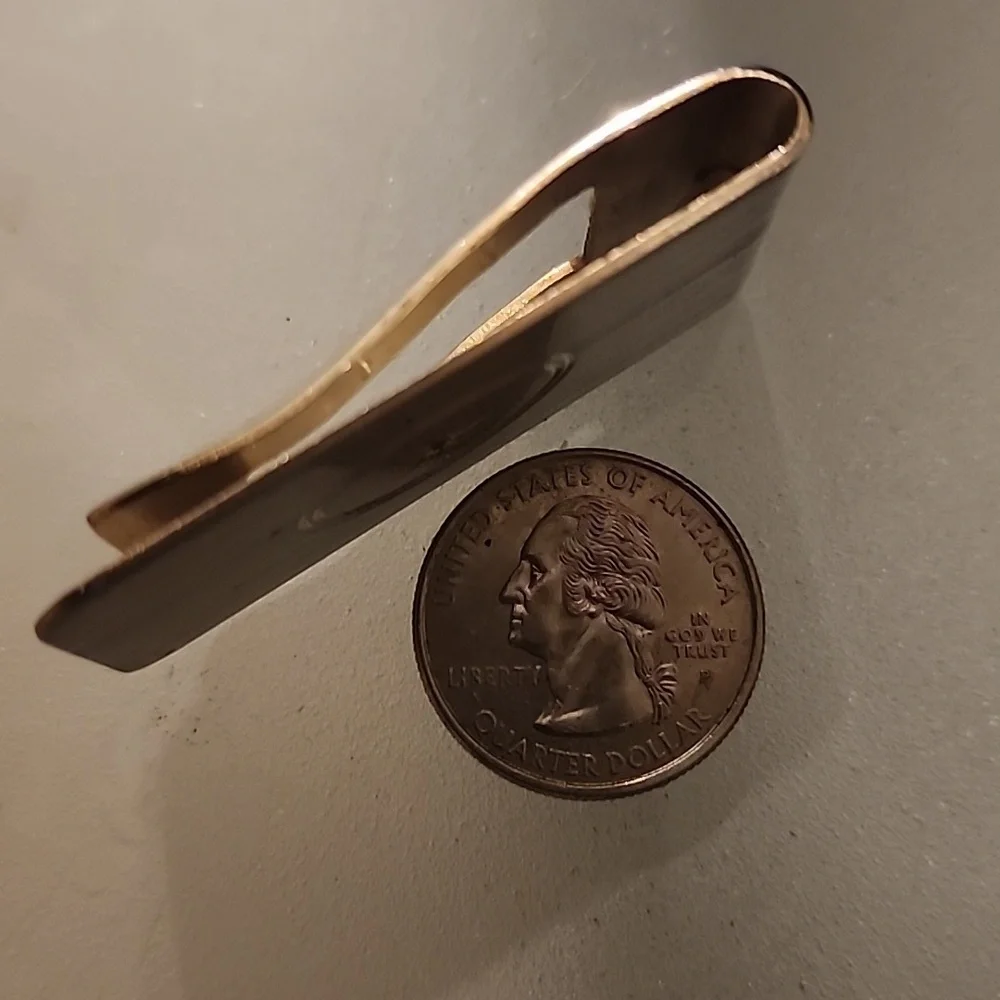 Goldtone  Money Clip With A Diamond Like Stone.